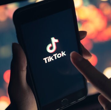TikTok app on a phone screen, showcasing Moonlane Media's expertise